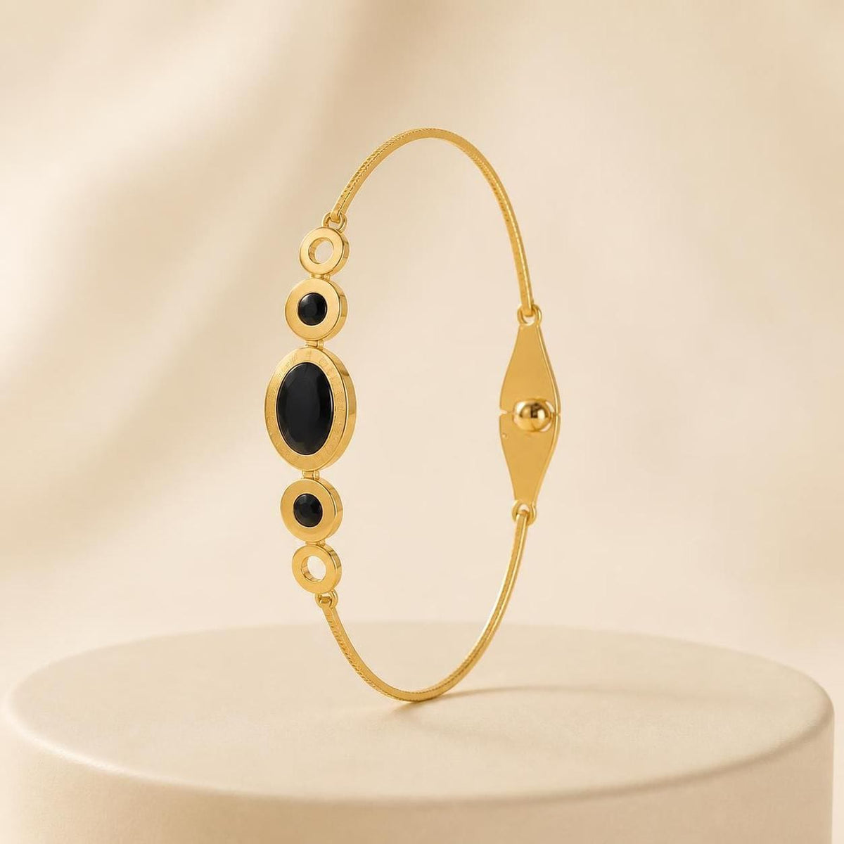 Black Oval Stone Gold-Tone Stainless Steel Bangle