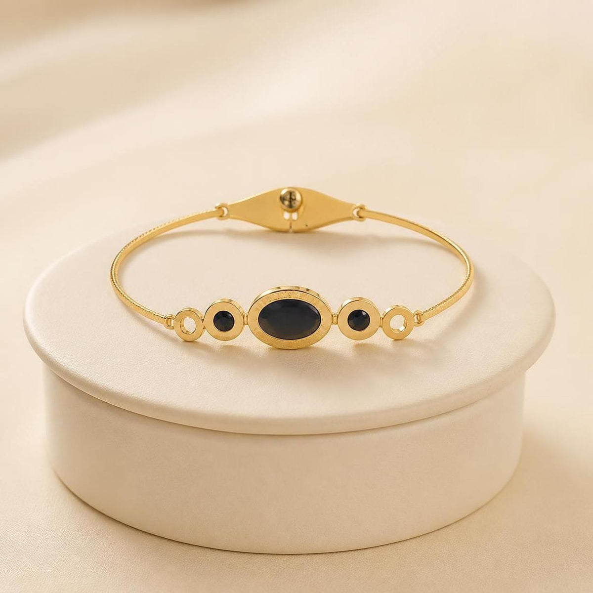 Black Oval Stone Gold-Tone Stainless Steel Bangle